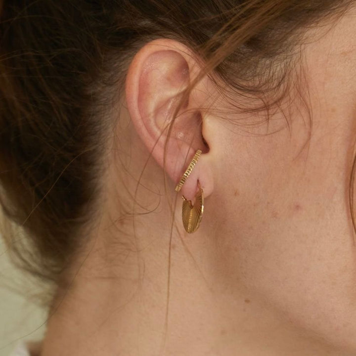 meta-huggie-hoop-earrings