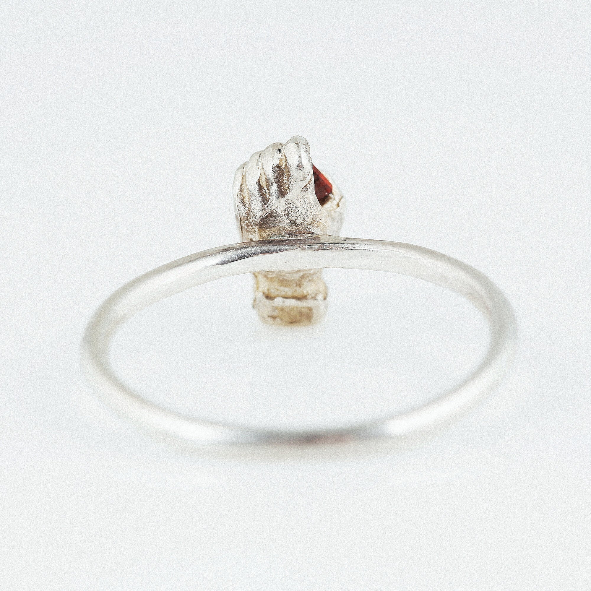 equal-heart-silver-hand-ring-with-garnet