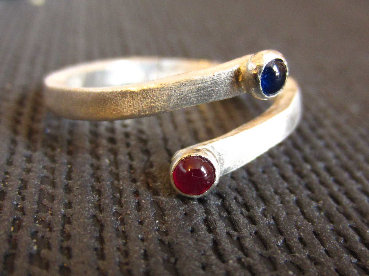 sapphire-and-ruby-you-and-me-crossover-silver-ring