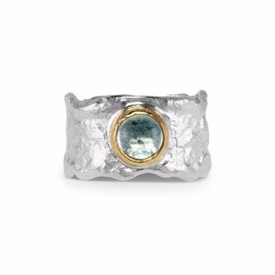 silver-ring-with-cabochon-blue-topaz-set-in-18k-gold