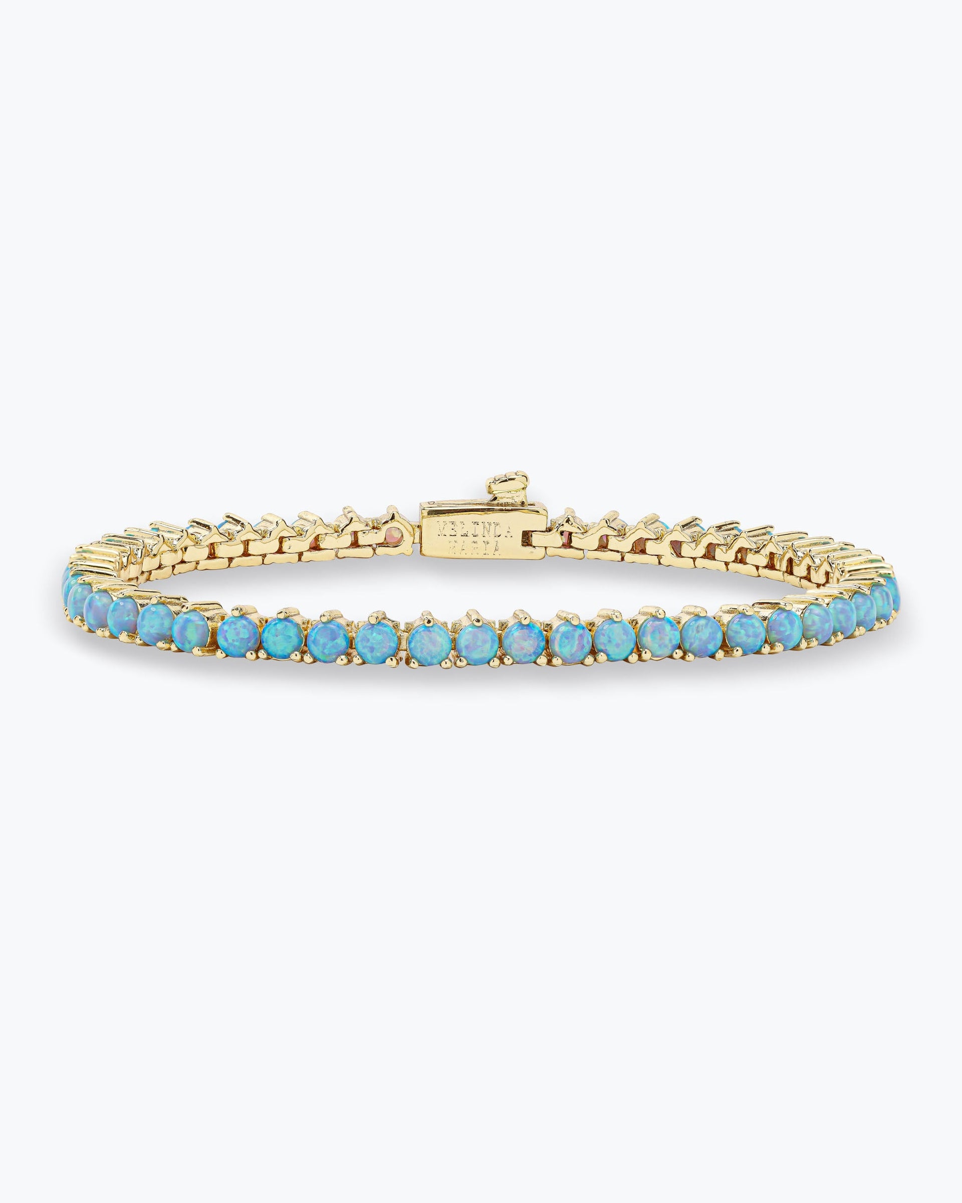 not-your-basic-tennis-bracelet-in-gold-and-blue-opal