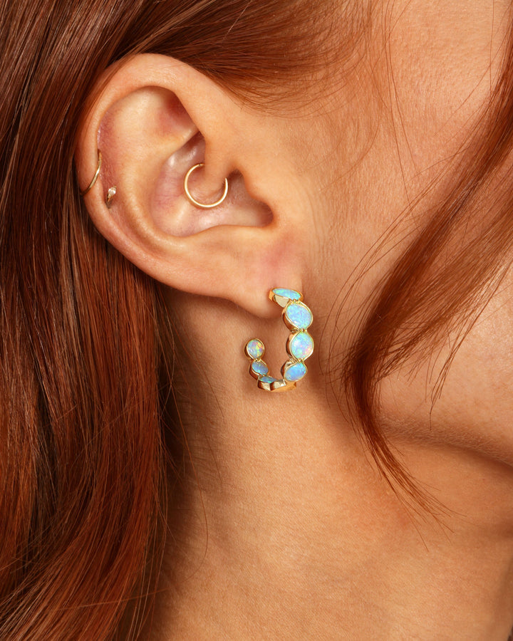 she-is-an-icon-blue-opal-hoops-in-gold-and-blue-opal