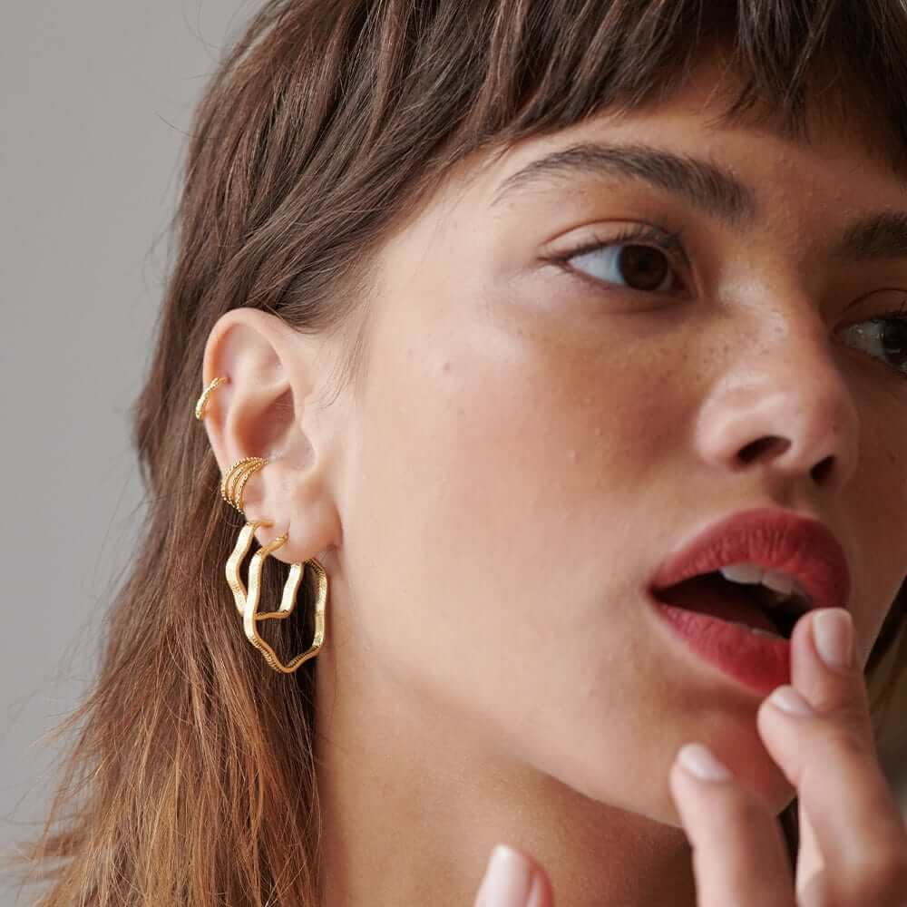 maxi-wavy-snake-hoop-earrings-daisy-london